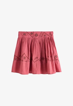 Pink opsamlet nederdel med mørke broderede geometriske og blomsteragtige mønstre omkring taljen og kanten, med små dekorative perler.