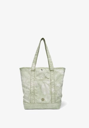 Light green tote bag with a smooth, glossy texture, featuring two long straps, a front pocket, and subtle tie-dye patterns.