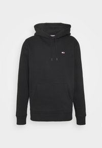 Sudadera con capucha negra, mezcla de algodón, bolsillo canguro, puños y dobladillo acanalados. Presenta un pequeño logo en el pecho. Textura suave.