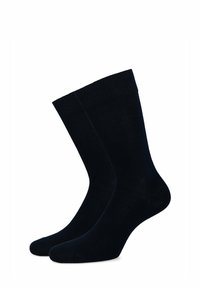 Ciemnoniebieskie skarpetki bawełniane o gładkiej fakturze, w klasycznej długości crew, z wzmocnionym palcem dla większej trwałości.