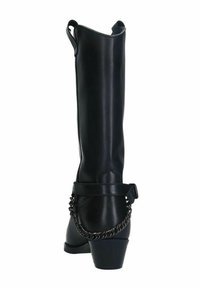 Botte noire en cuir montante avec un talon épais, dotée d'une chaîne décorative autour de la cheville et d'une languette à l'arrière pour un enfilage plus facile.