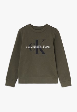 Sweat-shirt vert à col rond avec manches longues et poignets côtelés, présentant de grandes lettres noires "CK" et un texte blanc "Calvin Klein Jeans" sur le devant.
