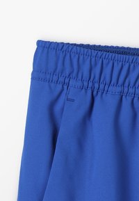 Nike Performance Pantalón corto de deporte - blue