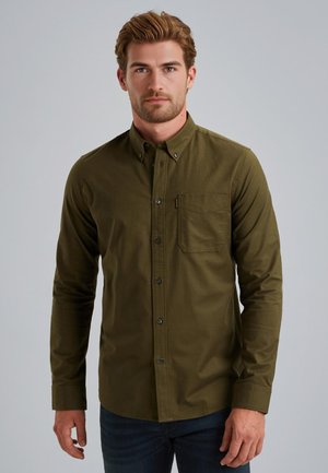 Camicia verde oliva con bottoni, maniche lunghe, una tasca sul petto e bottoni neri. Tessuto morbido con una superficie liscia e design aderente.