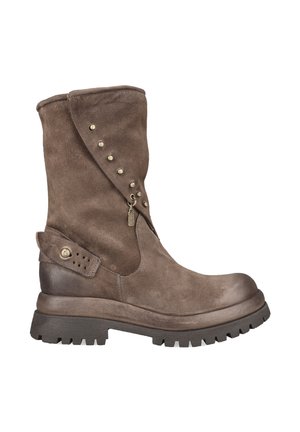Mid-calf brown suede boot with stud embellishments, a strap with a buckle near the heel, and a thick black lug sole.