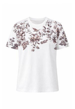 T-shirt blanc à manches courtes avec un motif floral détaillé en marron et rose sur la poitrine, les épaules et les manches.