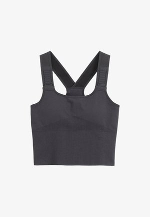 Soutien-gorge de sport noir avec une texture côtelée, un design en V dans le dos, des bretelles ajustables et une construction sans coutures pour le confort et le soutien.