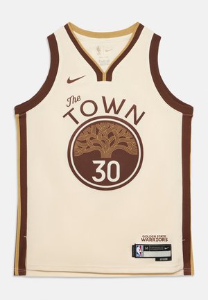 Canotta da basket color crema con il logo "The Town", dettagli marroni e numero del giocatore "30". Realizzata da Nike, include etichette e cartellini.