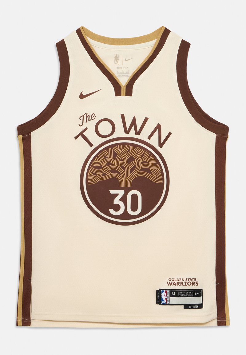 Kremfarget basketballtrøye med "The Town"-logo, brune aksenter og spillernummer "30." Laget av Nike, inkluderer merkelapper og etiketter.