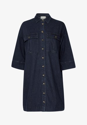 Denim shirt dress in dark blue, button-down front, two chest pockets, short sleeves, navy stitching, and silver button accents.