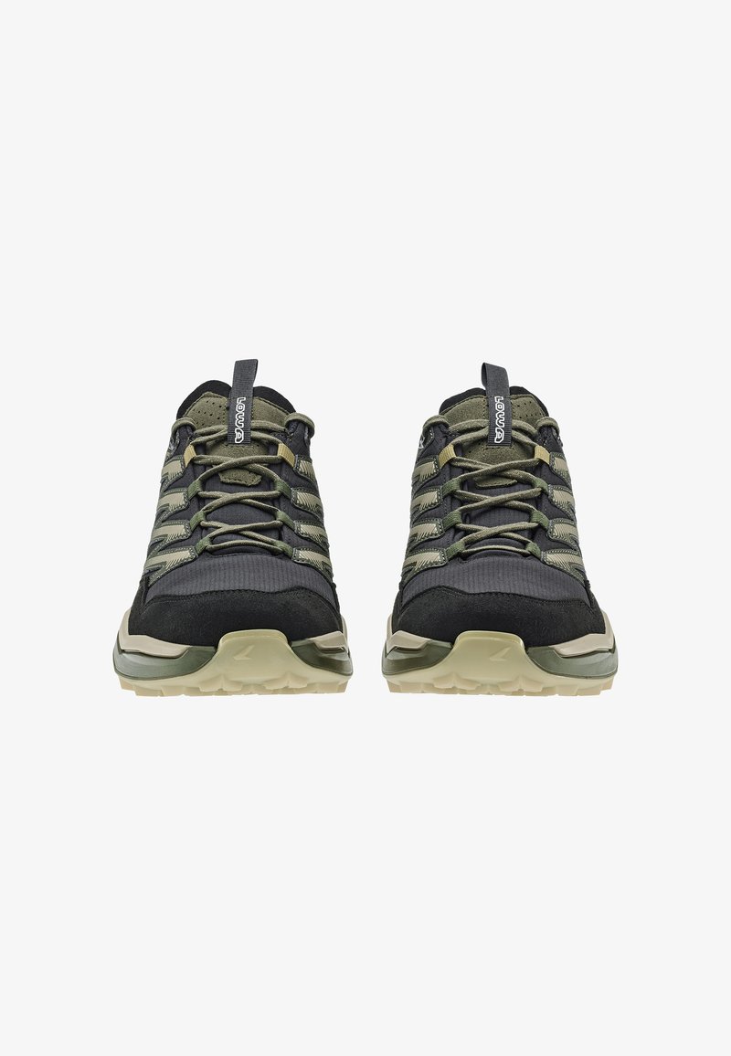 Lowa hiking shoes featuring a black and green color scheme, textured fabric upper, reinforced toe cap, and rugged sole for traction.