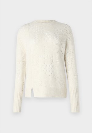 Gaismas, krēmkrāsas džemperis ar teksturētām zīmējumiem, ribotām piedurknēm un sānu šķēlumu. Izgatavots no mīksta, adīta materiāla.