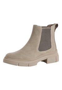 Bottine Chelsea en suede couleur tan avec semelle crantée, panneau latéral élastique et tirant à l'arrière.