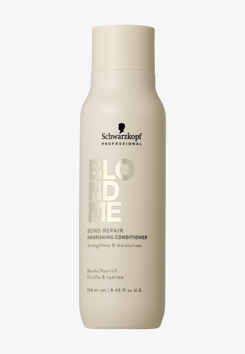 Vitt flaska med en böjd form, med svart och silver text. Etiketterna anger "BlondMe Bond Repair Nourishing Conditioner" och volym.
