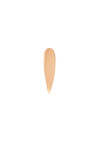 Flytande foundation-swatch i en ljusbeige nyans, med en slät, glansig textur och en avlång, avsmalnande form mot en vit bakgrund.
