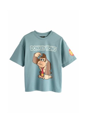 Lichtblauwe t-shirt met korte mouwen met een afbeelding van een cartoon-aap en de tekst "DONKEY KONG". Heeft een ronde halslijn en is gemaakt van zachter katoen.