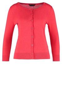 Korallfärgad stickad cardigan med rund hals, lång ärm och knäppning framtill. Har ribbat mönster vid ärmsluten och fållen.