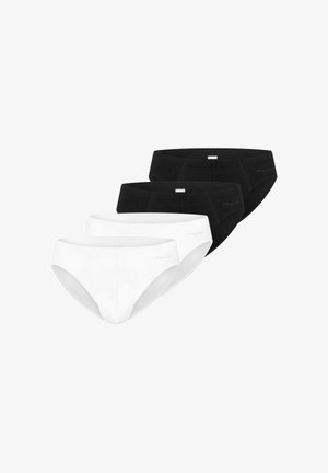 Fire herreunderbukser i sort og hvid, arrangeret i to rækker med hvide underbukser foran og sorte underbukser bagved.