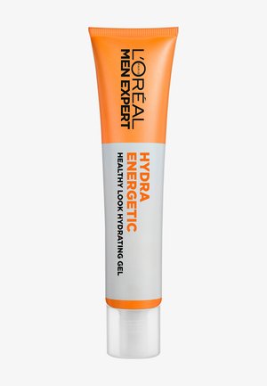 Gel hydratant L'Oréal Men Expert Hydra Energetic dans un tube avec un bouchon orange et des détails orange, corps argenté, texte noir audacieux. Design lisse et moderne.