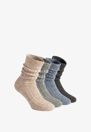 Four pairs of ribbed crew socks in beige, blue, gray, and charcoal. Each has a soft texture and gathered cuff design.