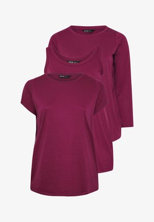 Kolmen naisten vaaleanliilan sävyisen topin setti, joissa on erilaiset hihat: lyhythihainen, hihaton ja pitkähihaiset, kaikki pyöreällä pääntiellä.