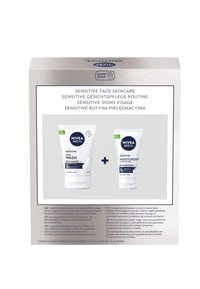 NIVEA MEN Sensitive skincare set featuring a face wash and moisturizer, both tubes are white with blue accents, labeled clearly for use.