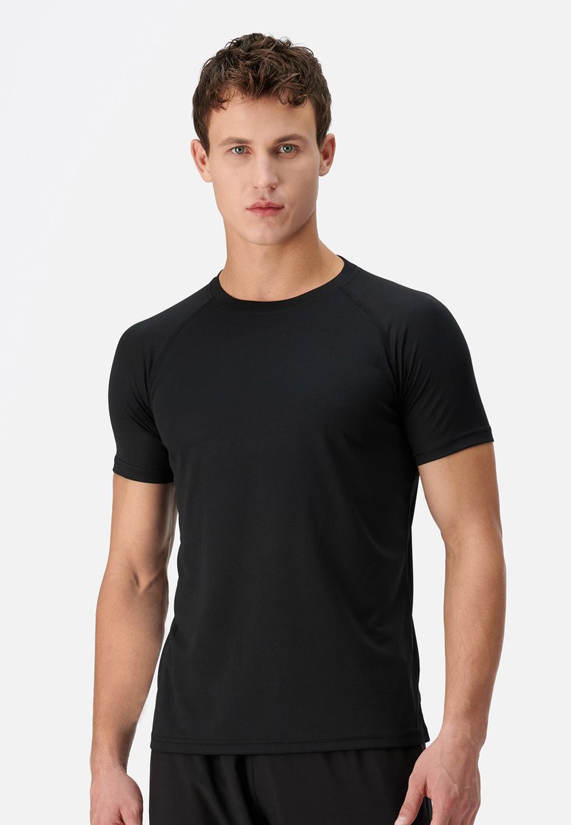 DAGI ACTIVE - Basic T-shirt - black - Zalando.ie