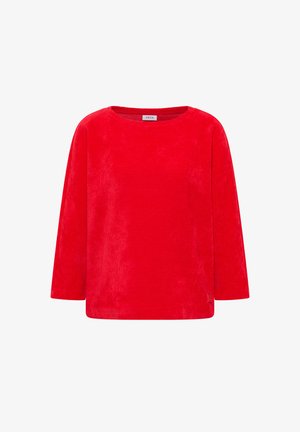 Červené tričko s dlouhým rukávem vyrobené z měkké látky. Má kulatý výstřih a jednoduchý, uvolněný střih s minimálním zdobením.