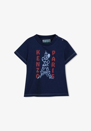 T-shirt bleu marine à manches courtes avec un graphisme de la tour Eiffel, "KENZO" en rouge et "PARIS" en blanc. Bouton pression à l'épaule.