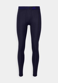 Svart atletiska leggings med figurnära passform, tillverkade av stretchmaterial. Har en blå märkes midjeband med texten "TECHFIT".