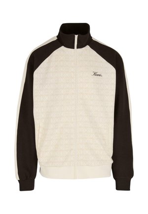 Track jacket with a high collar, zip front, cream and dark brown color blocks, patterned body, and logo detailing. Features elastic cuffs and hem.