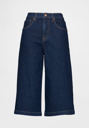 Vide mørk denim culottes med høy midje, med kobberfargede knapper og sømmer, kontrasterende sømmer og lommer.
