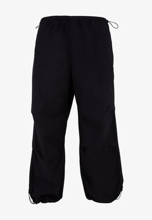 Schwarze, locker sitzende Cargo-Hosen mit elastischem Bund und verstellbarem Kordelzug. Mit Reißverschlusstaschen und Bündchen an den Knöcheln.