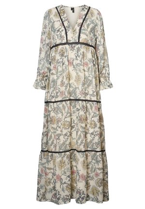 Robe longue fleurie avec col en V, manches longues, poignets à volants et bordure noire sur la poitrine et les volants de la jupe en tissu crème.