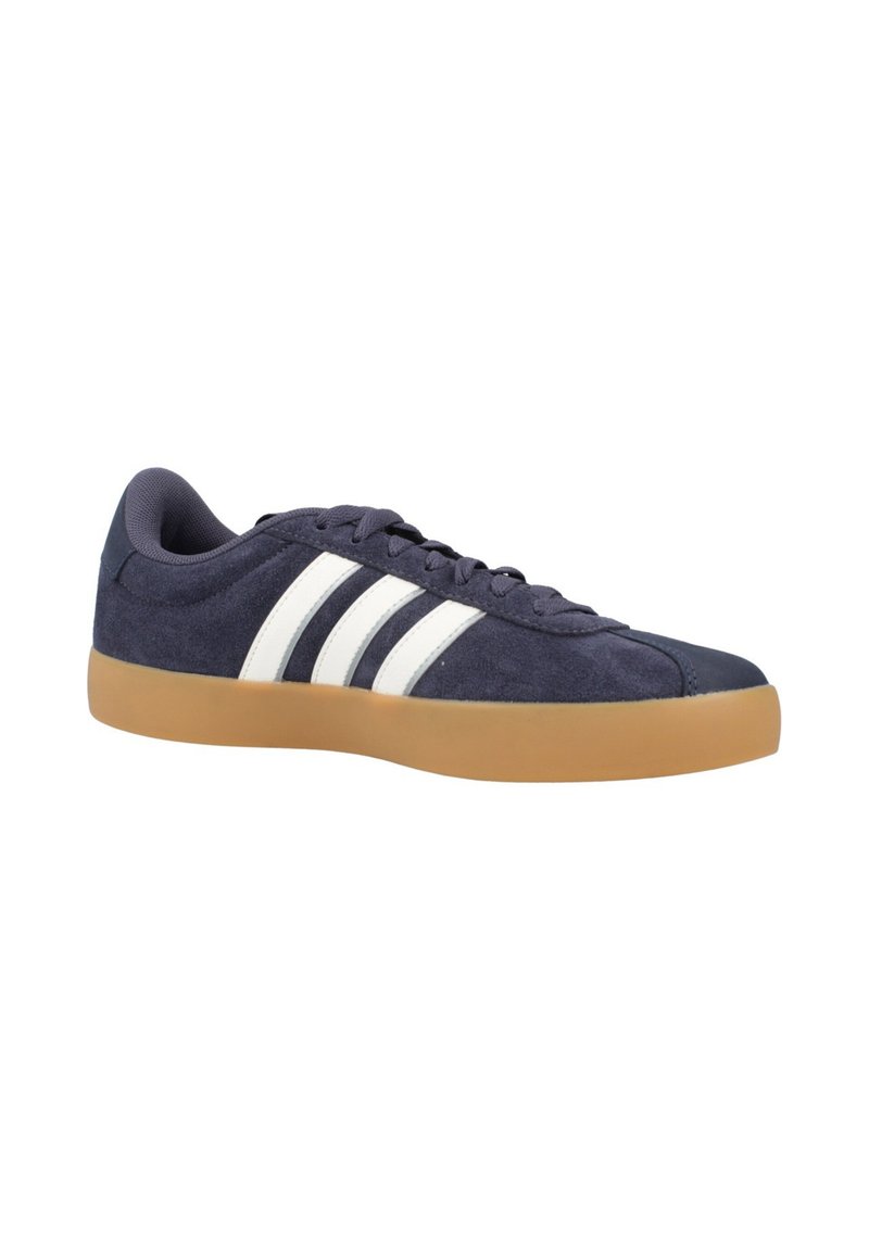 Navy suede sneakers with white three-stripe design, round toe, rubber gum sole, and textured upper. Laced closure and padded collar.