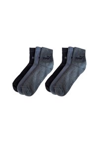 Six pairs of Puma ankle socks in black, dark gray, and light gray, arranged in two groups of three pairs each.