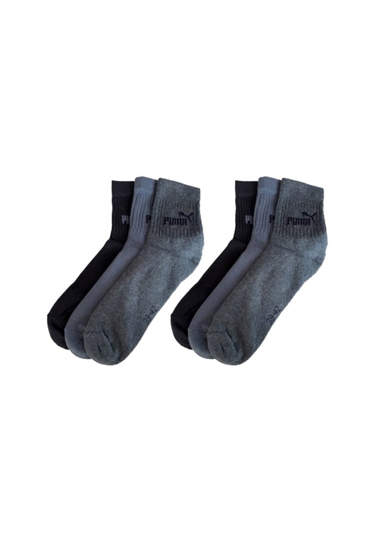Six pairs of Puma ankle socks in black, dark gray, and light gray, arranged in two groups of three pairs each.