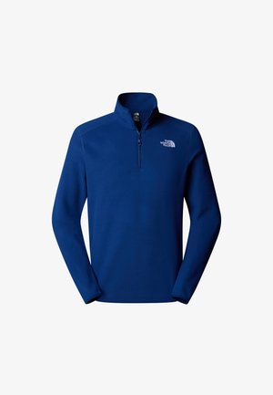 Sudadera de forro polar azul marino con cremallera de un cuarto en la parte delantera, cuello alto y logo bordado. Textura suave y mangas largas.