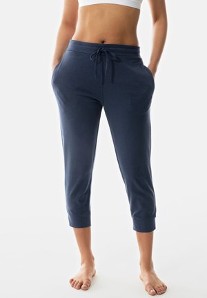 Marineblaue, verkürzte Sweatpants aus weichem Stoff, mit einem elastischen Bund und Kordelzug, Seitentaschen und gerippten Bündchen.