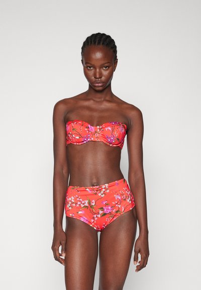 Red floral bikini featuring a strapless top with a ruched design and high-waisted bottom, adorned with pink and white flower prints.