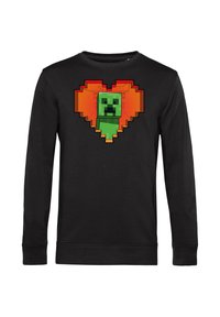 Felpa nera a maniche lunghe con un design di personaggio verde pixelato all'interno di una forma a cuore arancione. Tessuto morbido con polsini a coste.