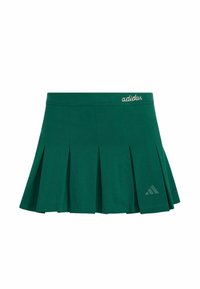 Zelená športová sukňa s plisovaním vyrobená z tkaniny. Obsahuje elastický pás a nenápadné logo Adidas v bielej farbe a trojuholníkové logo v tmavozelenej farbe.