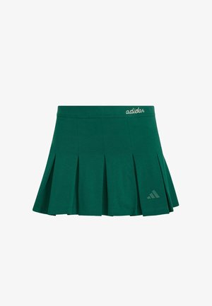 Zelena plisirana atletska suknja izrađena od tkanine. Ima elastičan pojas i suptilan Adidas logo u bijeloj boji, te trokutasti logo u tamnozelenoj boji.