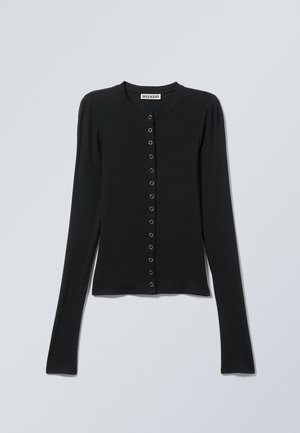 Melnā garroku džemperis ar apaļu kakla izgriezumu un sudraba pogām priekšpusē, ar zīmola Weekday etiķeti.