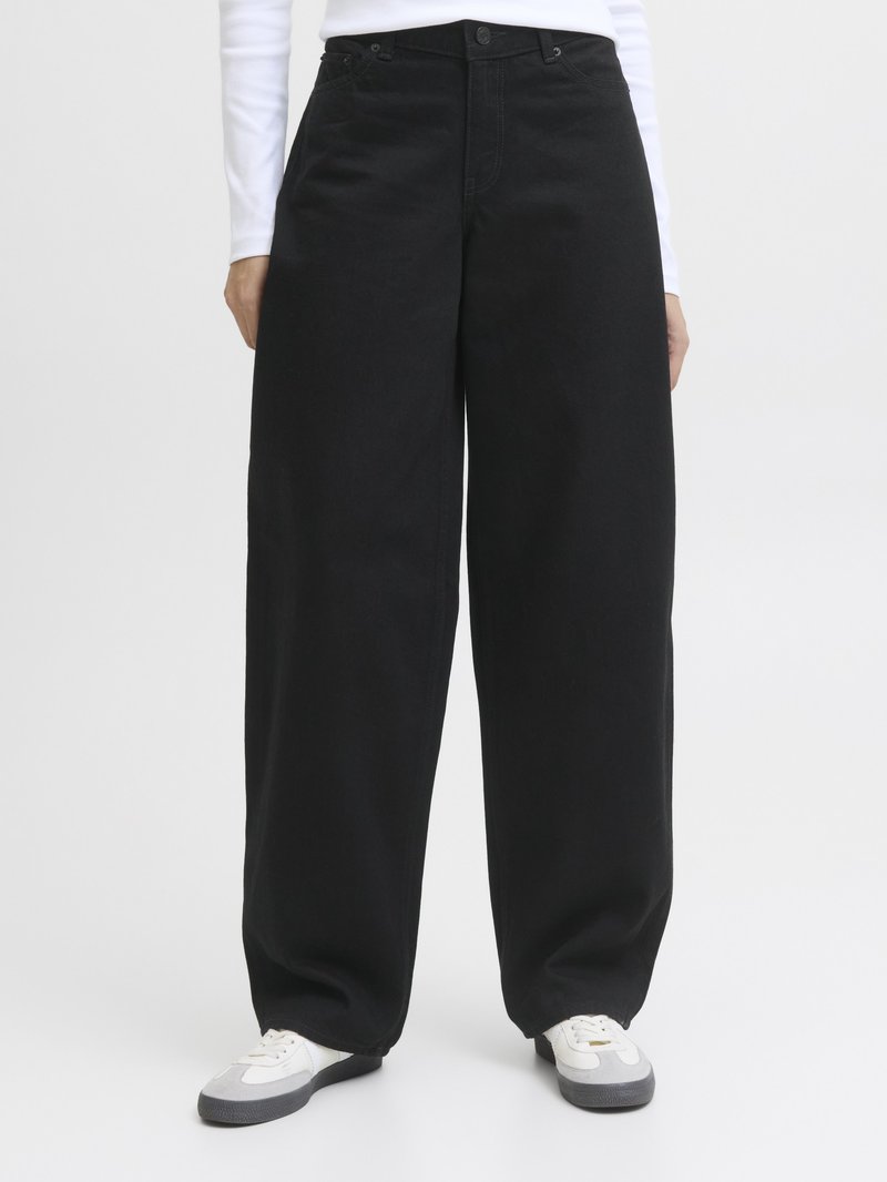 Black wide-leg denim pants with a high waist, featuring a button closure, belt loops, and side pockets. Worn with white and gray sneakers.