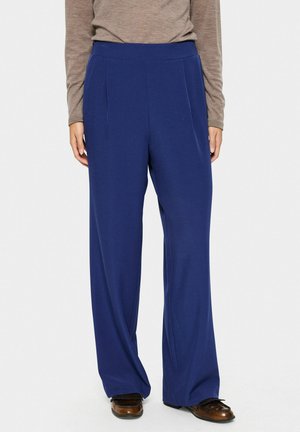 Navy blue wide-leg trousers with a smooth texture, featuring a high, elastic waistband and subtle front pleats.