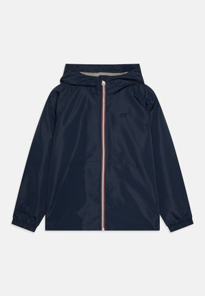 Navy blue rain jacket with a hood, front zip closure featuring a red and white stripe, elastic cuffs, and side pockets.