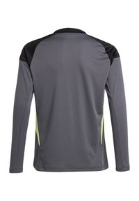 T-shirt de sport à manches longues en gris foncé avec des accents noirs et des panneaux latéraux vert citron ; il est fabriqué dans un tissu lisse et léger et possède un col rond.