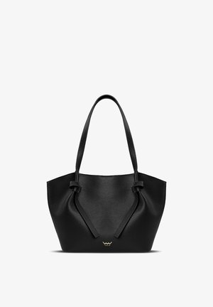 Black leather tote bag with a structured shape. Features dual handles and decorative knot accents on the sides. Gold logo at the front.