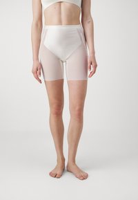 White high-waisted shorts made of smooth, glossy fabric with semi-transparent side panels, featuring a fitted design and mid-thigh length.